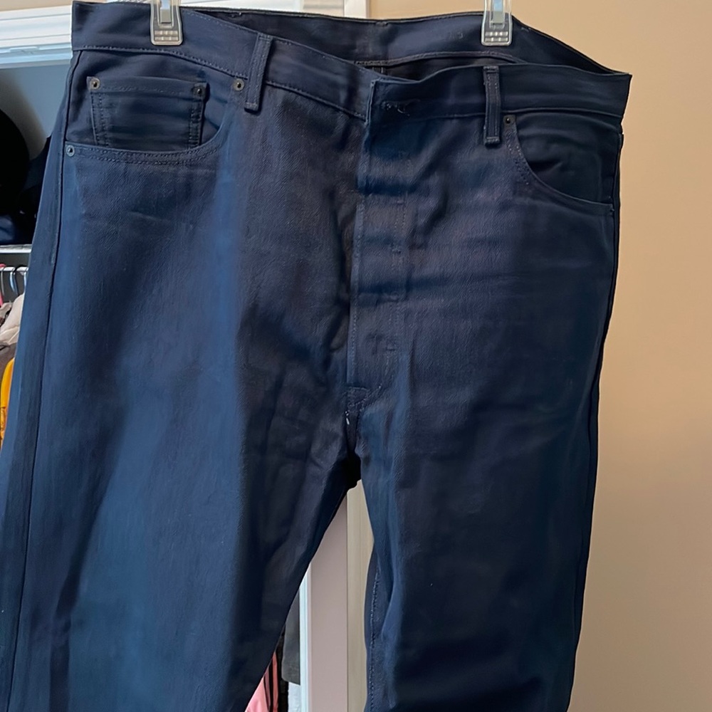 Practically new button fly Levi’s worn once! No holes, fading, smoke-free